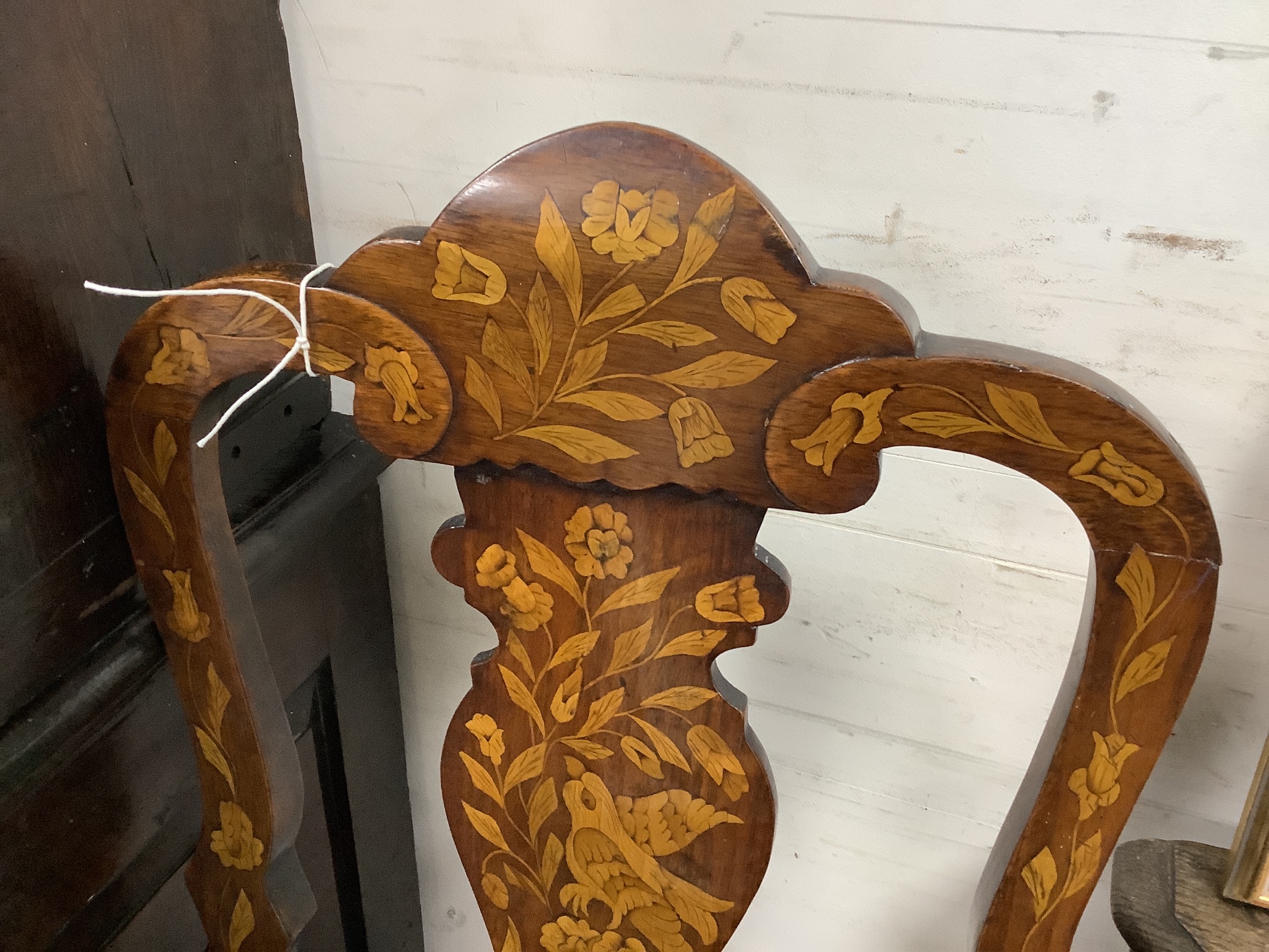 A pair of late 18th century Dutch floral marquetry walnut high back dining chairs